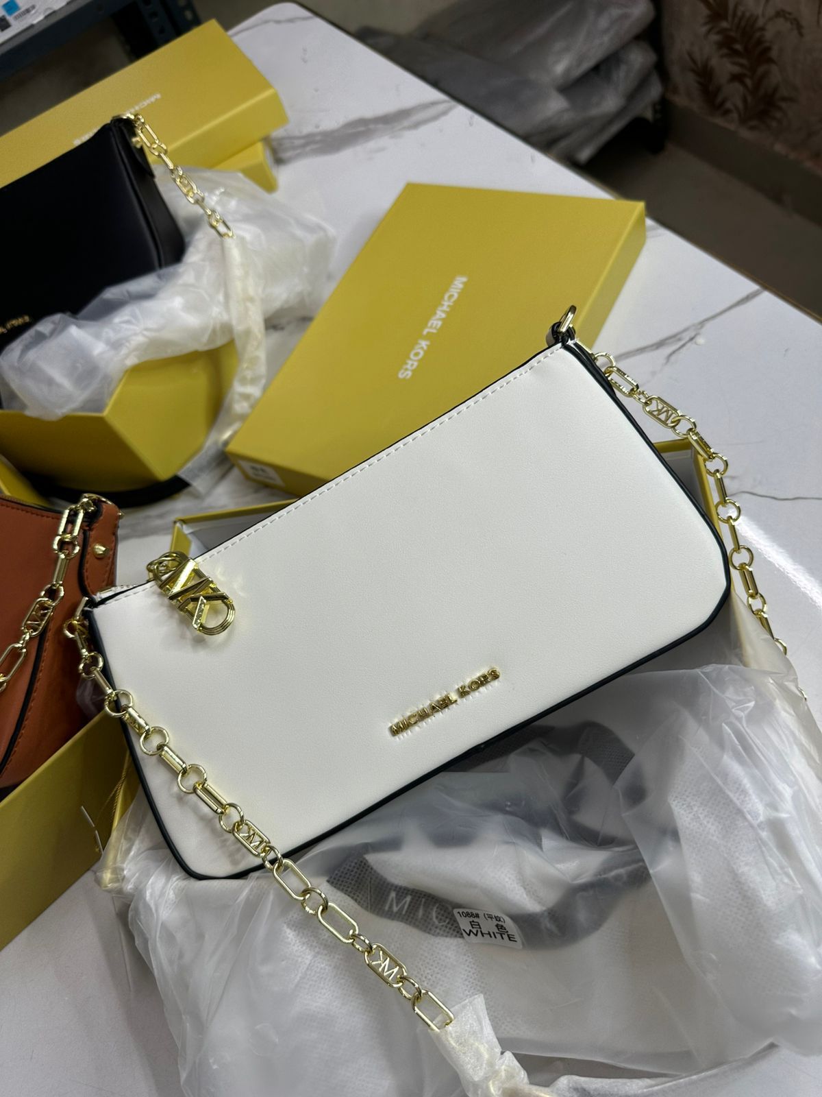 MICHAEL KORS SLING BAG