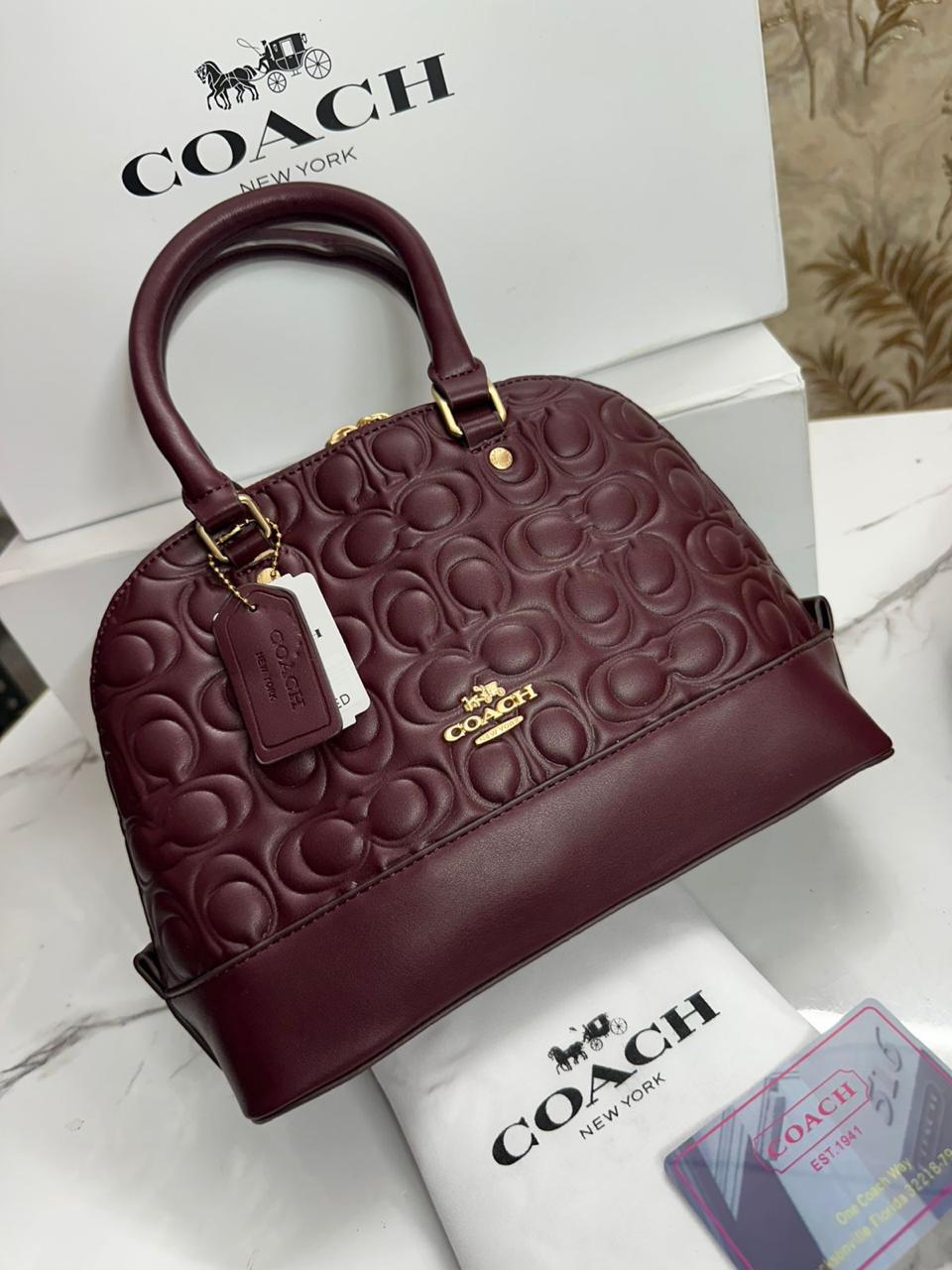 COACH EMBOSSED ALMA BAG