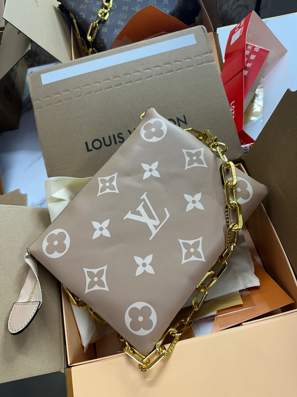 LOUIS VUITTON COUSSIN